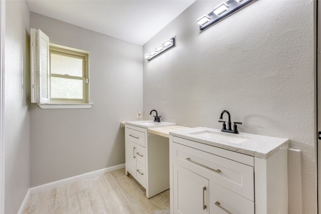 Full bathroom with vanity and wood finished floors | Image 27