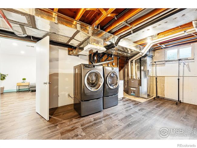 large laundry room inlcudes washer and dryer and mechanical area | Image 28