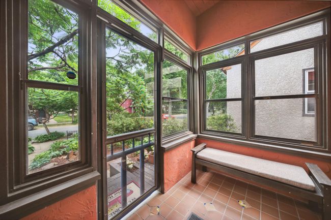 Bright and colorful front patio can double as a mudroom | Image 4