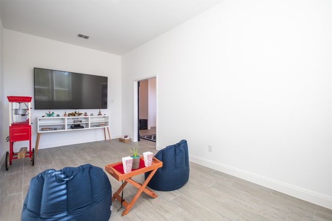 Enjoy some much needed relaxation in the media room located in the front of the home! | Image 4