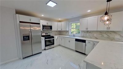 Renovated kitchen with new stainless steel appliances | Image 3