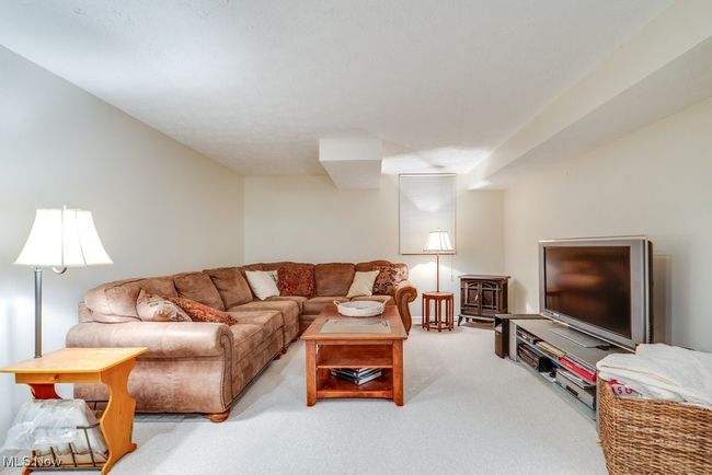 Living room with carpet floors | Image 38