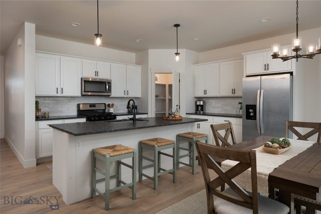 Open concept, granite countertops, gas stove. | Image 4