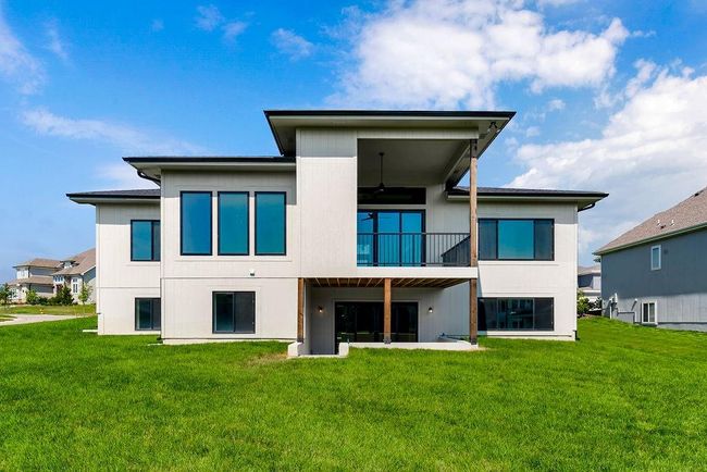 Back of property featuring a yard and a balcony | Image 35