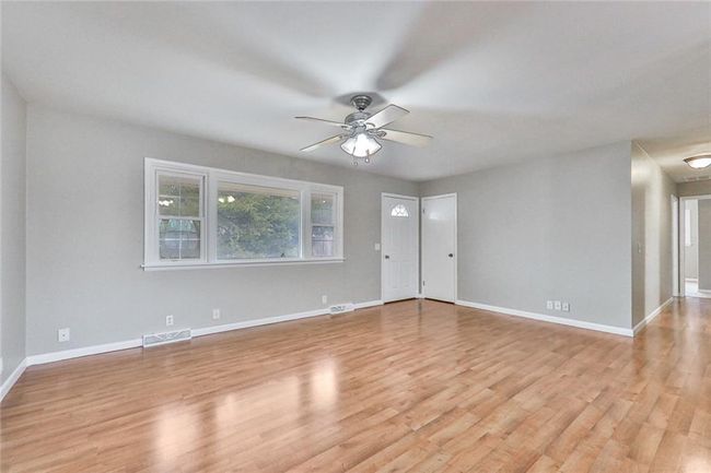 Unfurnished room with ceiling fan and light hardwood / wood-style flooring | Image 8
