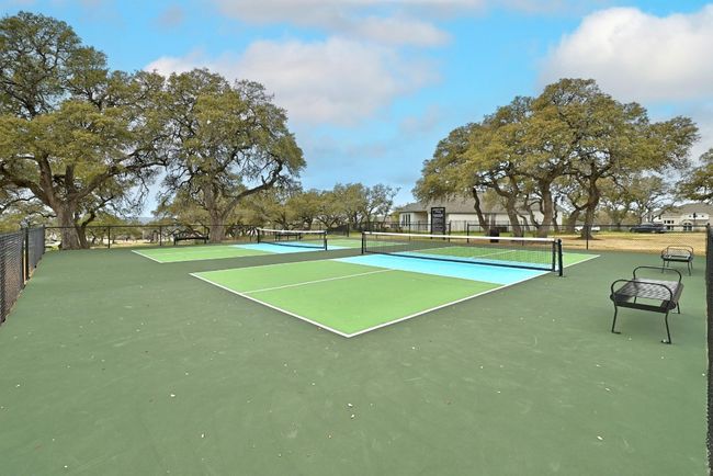 View of tennis court with fence | Image 40