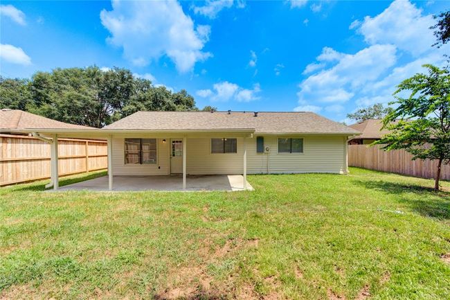 The home has a newer roof, large concreted back patio cover, vinyl siding, a new electric panel, and fresh paint job! | Image 21