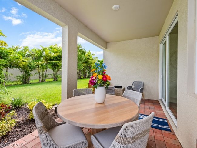 Unwind in the comfort of your covered lanai — a versatile haven where dining and relaxation seamlessly intertwine, creating the perfect outdoor retreat | Image 9