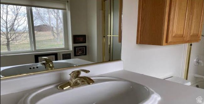 Bathroom with plenty of natural light and vanity | Image 5