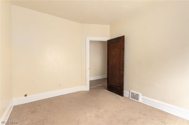 Empty room with carpet flooring | Image 15