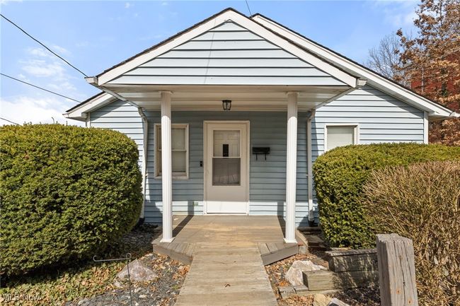 View of exterior entry with covered porch | Image 4