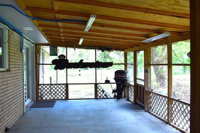 Wonderful screened porch with sliding glass doors into dining room | Image 11