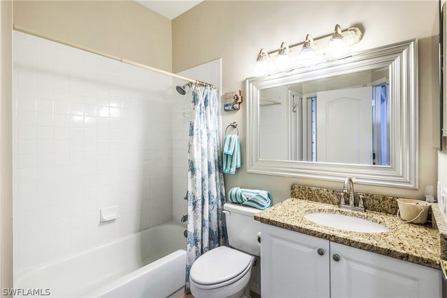 2nd full bathroom featuring shower / bath combination with granite countertop vanity. | Image 24