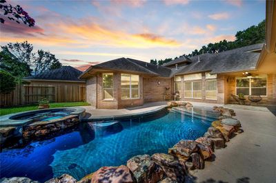 Enjoy resort style living everyday from the comfort of your own home featuring a lagoon style pool and spa. | Image 3