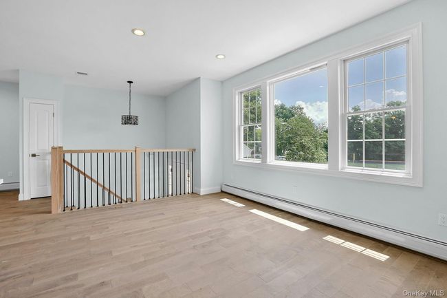 living room with picture window | Image 4