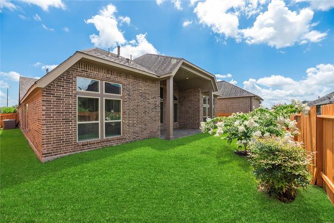 The backyard is also meticulously landscaped. | Image 31