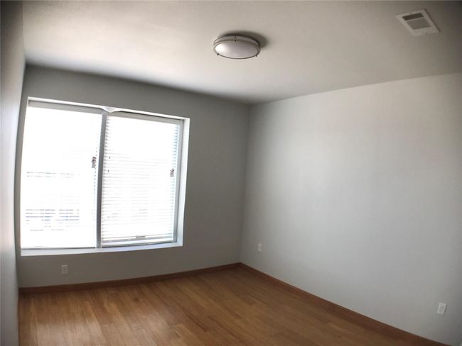 Unfurnished room featuring wood finished floors and baseboards | Image 16