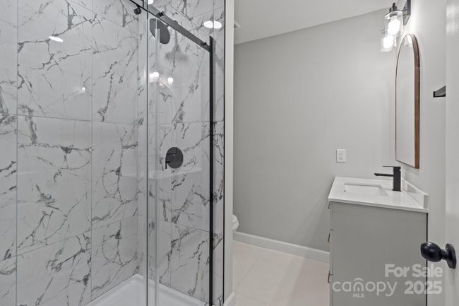 Bathroom 3 on the main level off living room | Image 15