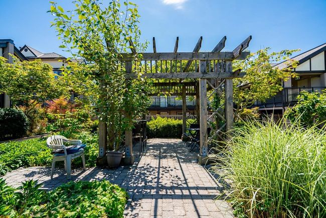 Inner courtyard provides seating amongst the flowers. | Image 5