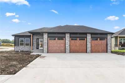 A full 3 car flat driveway. | Image 3