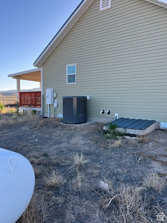 View of home's exterior with a central AC unit | Image 23