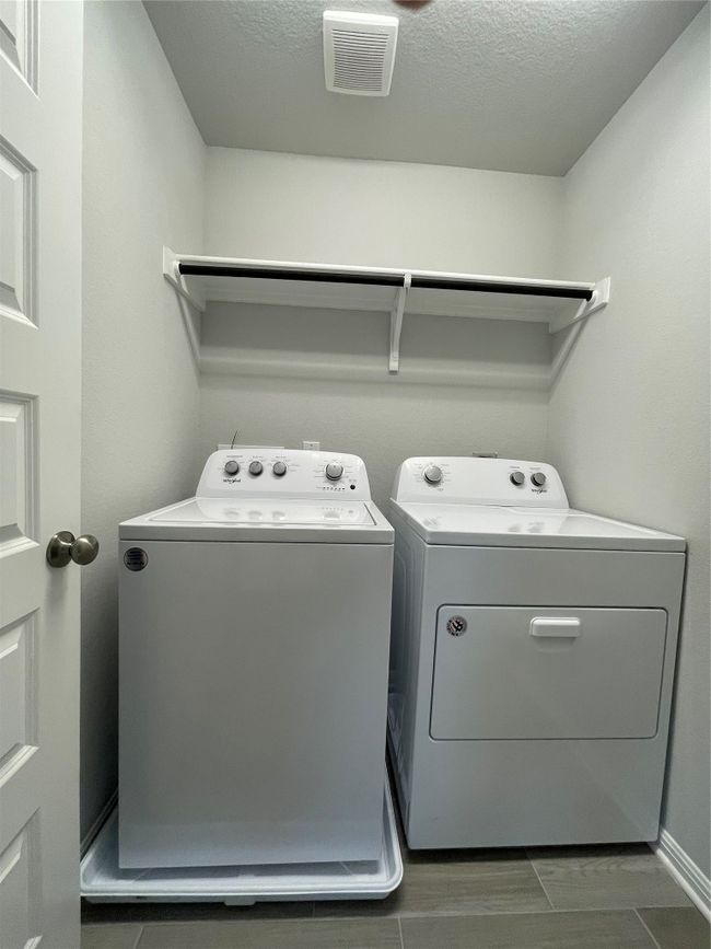 Washroom with washing machine and dryer and a textured ceiling | Image 20