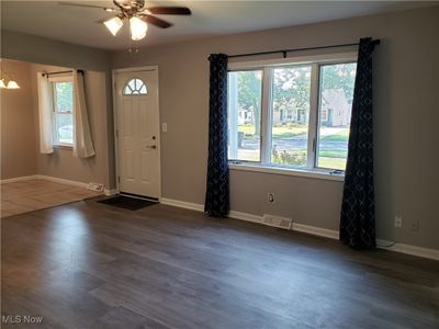 Living Room featuring dark wood-type flooring and ceiling fan | Image 2