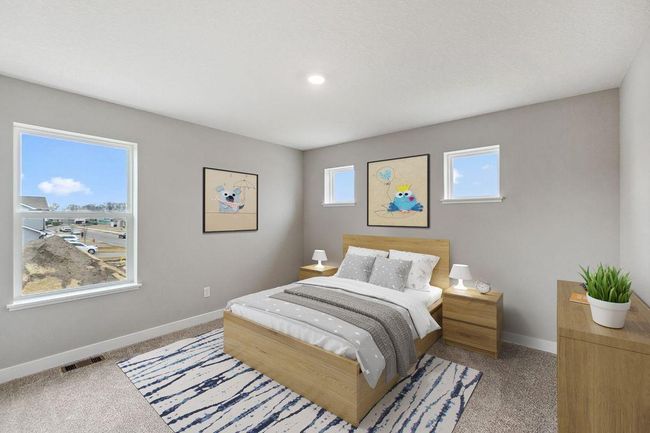 Spacious secondary bedroom with natural light. Model photos. Options and colors will vary. | Image 28