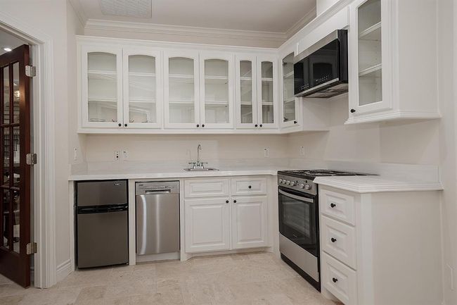 This is a full kitchen in the upstairs apartment - ideal for extended staying guests. They can take the stairs or use the elevator | Image 23