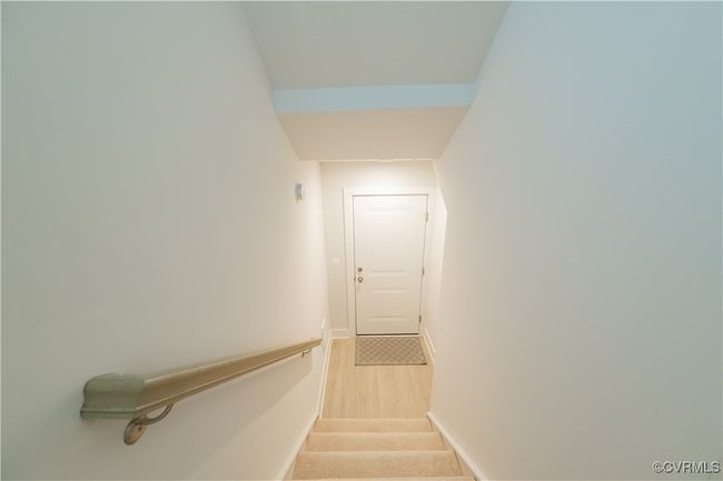 Staircase with baseboards and wood finished floors | Image 5