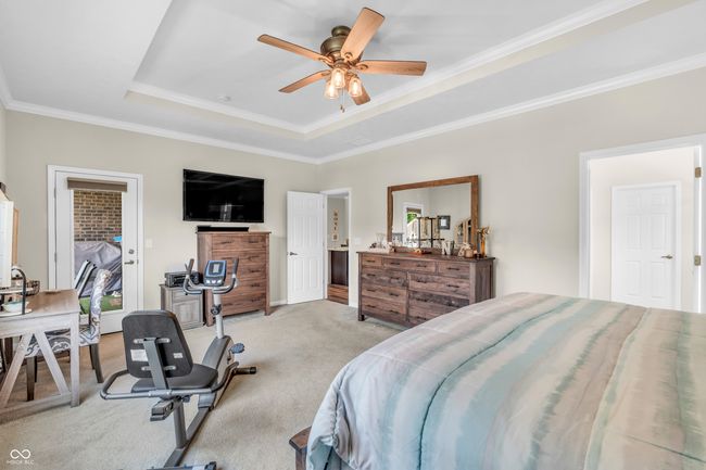 primary bedroom w/private entrance to covered patio, trek deck w/hot tub and cable railing | Image 35