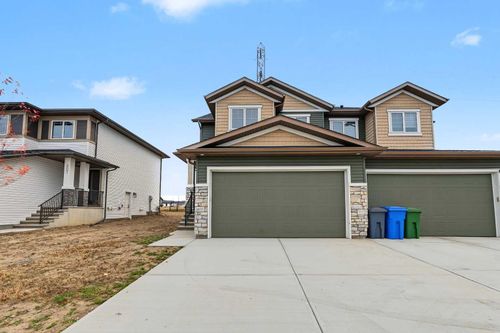 311 Dawson Dock Way, Home with 4 bedrooms, 3 bathrooms and 4 parking in Chestermere AB | Card Image