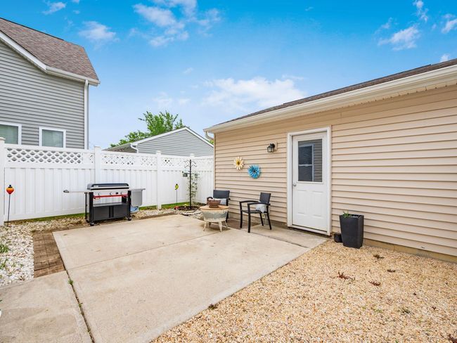 Replaced grass with pebbles for a low-maintenance backyard | Image 28