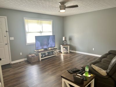 Living room looking back at the front door. | Image 3