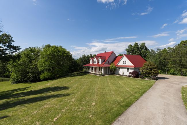 Eye Catching curb appeal with red metal roof. | Image 5