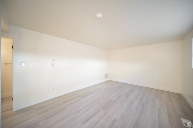 Unfurnished room with light wood-type flooring | Image 7