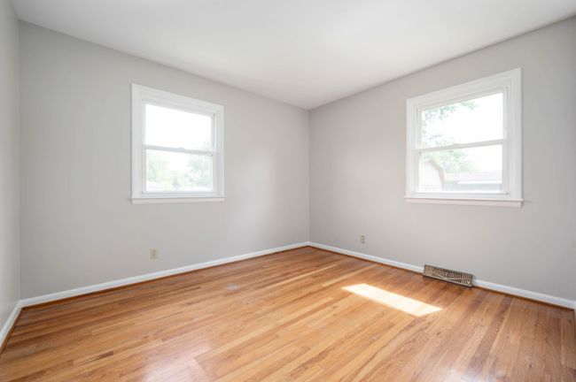 Original hardwood floors and fresh paint in all bedrooms | Image 14