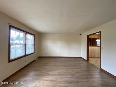 Living Room with laminate wood flooring | Image 2