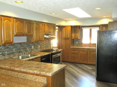 Spacious Kitchen with Custom Back Splash | Image 3