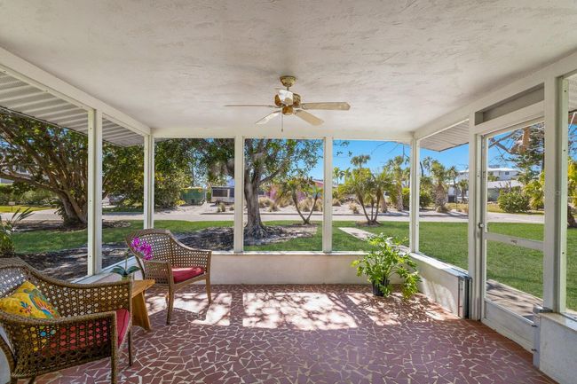 The lanai is a serene spot to watch the neighborhood activities yet enjoy being tucked away. | Image 9