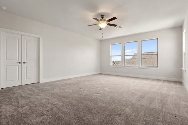 Spare room with carpet, visible vents, a ceiling fan, and baseboards | Image 27