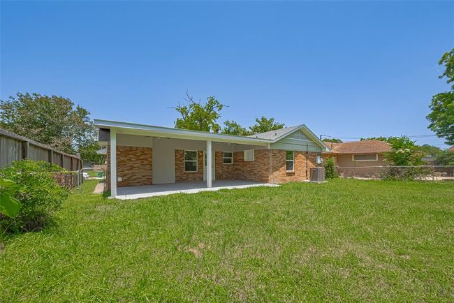 From another angle, the backyard's generous size and verdant condition are evident — plenty of space to roam or garden. | Image 31
