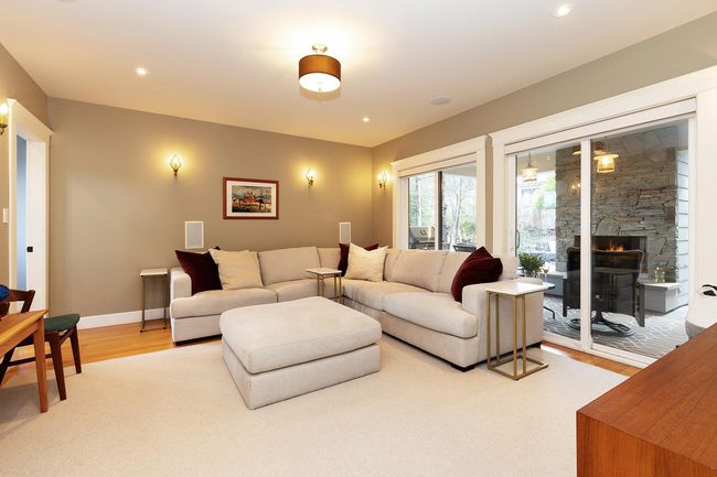 Living room with recessed lighting, light wood-style flooring, a fireplace, and baseboards | Image 8