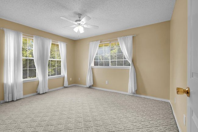 Second Floor bedroom 2 with a ceiling fan, healthy amount of natural light, and a textured ceiling | Image 19