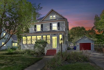 Featuring a charming 1915 Arts & Craftsman, 3 bed/3 bath positioned in downtown New Richmond. Original character shine through with hardwood floors, beautiful trim, built-in cabinets, custom kitchen, formal dining room and two staircases. | Image 1