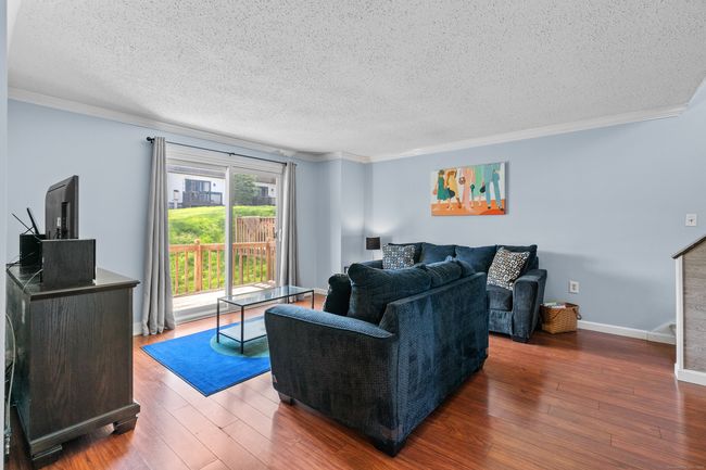 Living room with sliders to the back deck. | Image 7