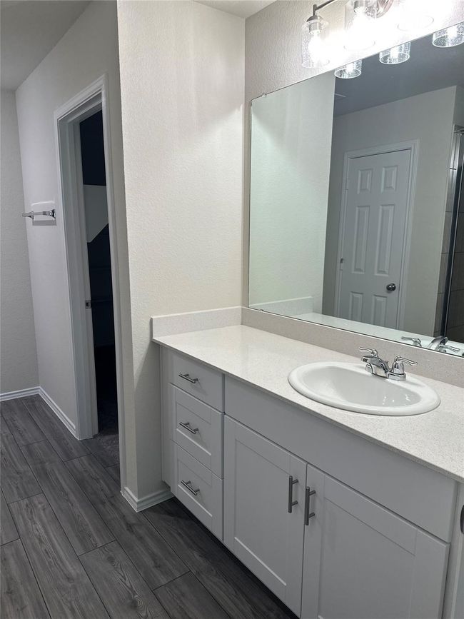 Bathroom with vanity and wood finished floors | Image 9