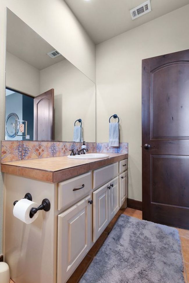 Bathroom upstairs with vanity and tile patterned floors | Image 23