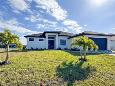 View of front of property with a front lawn and a garage | Image 2