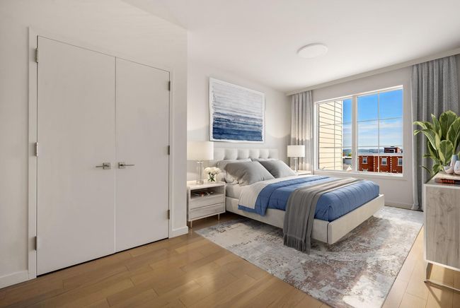 Bedroom featuring light wood-type flooring, a closet, and baseboards | Image 6